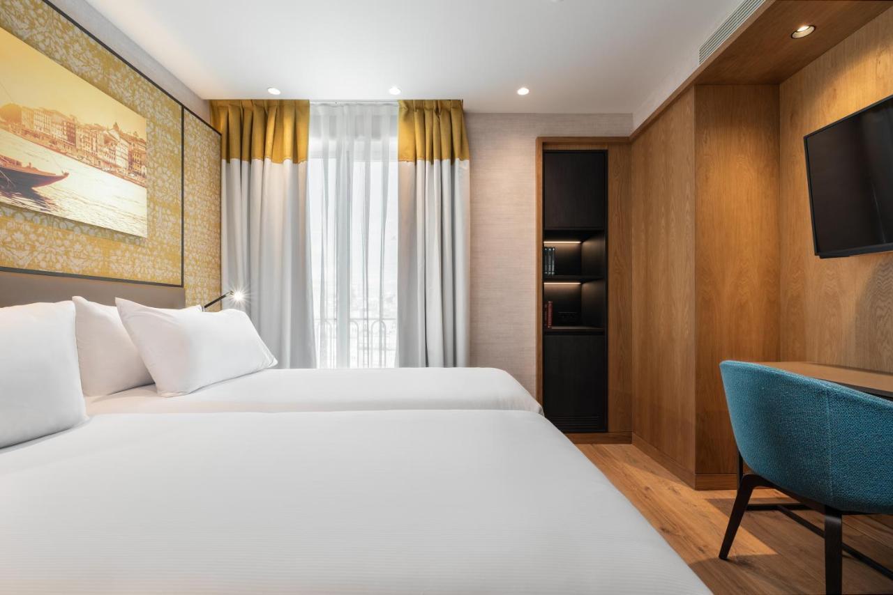 ホテル Eurostars Aliados ポルト エクステリア 写真 A room at the hotel
