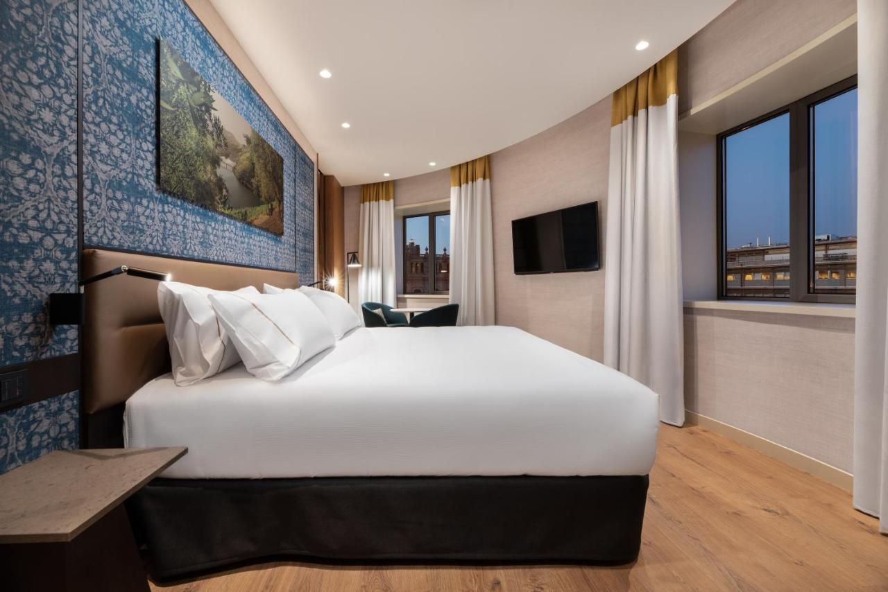 ホテル Eurostars Aliados ポルト エクステリア 写真 A bedroom at the hotel